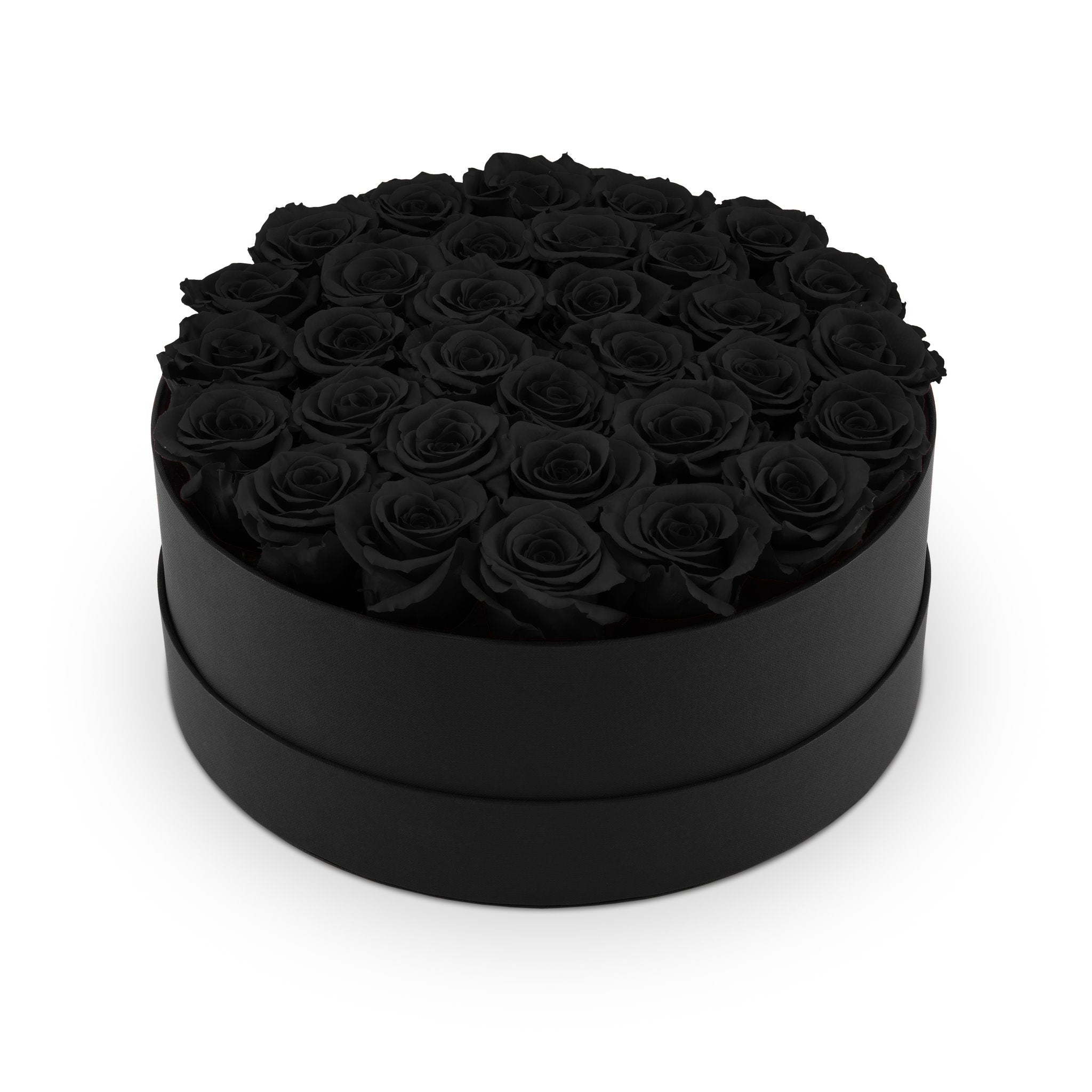 Black round box filled with black roses on a white background
