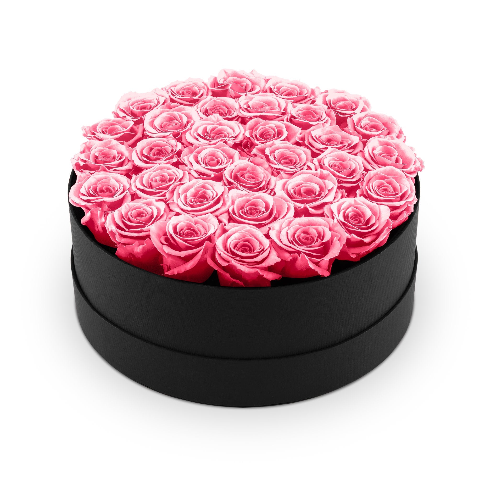 Black round box filled with pink roses on a white background
