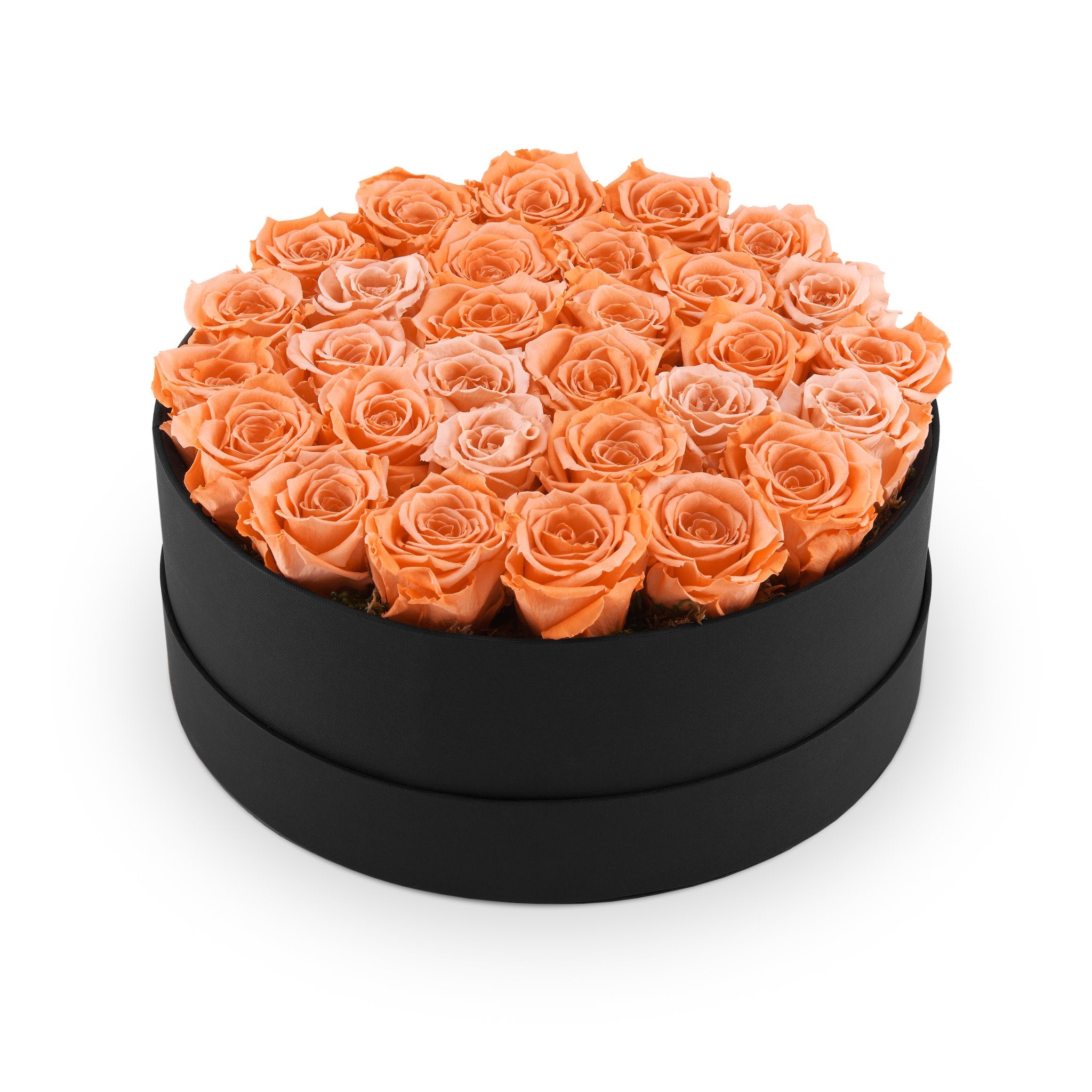 Black round box filled with orange roses on a white background