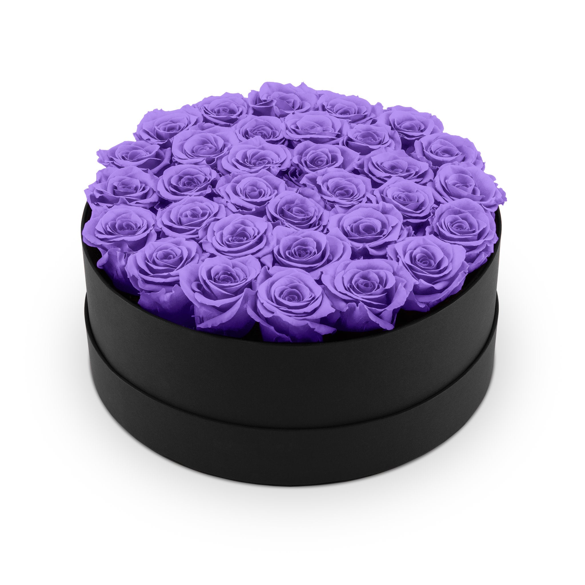 Black round box filled with purple roses on a white background