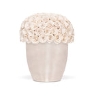 White vase filled with white roses on a white background