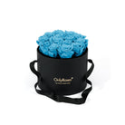 Black box with blue roses and 'Only Roses' branding on a white background