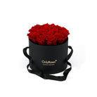 Black round box with redroses and 'Only Roses' logo on a white background