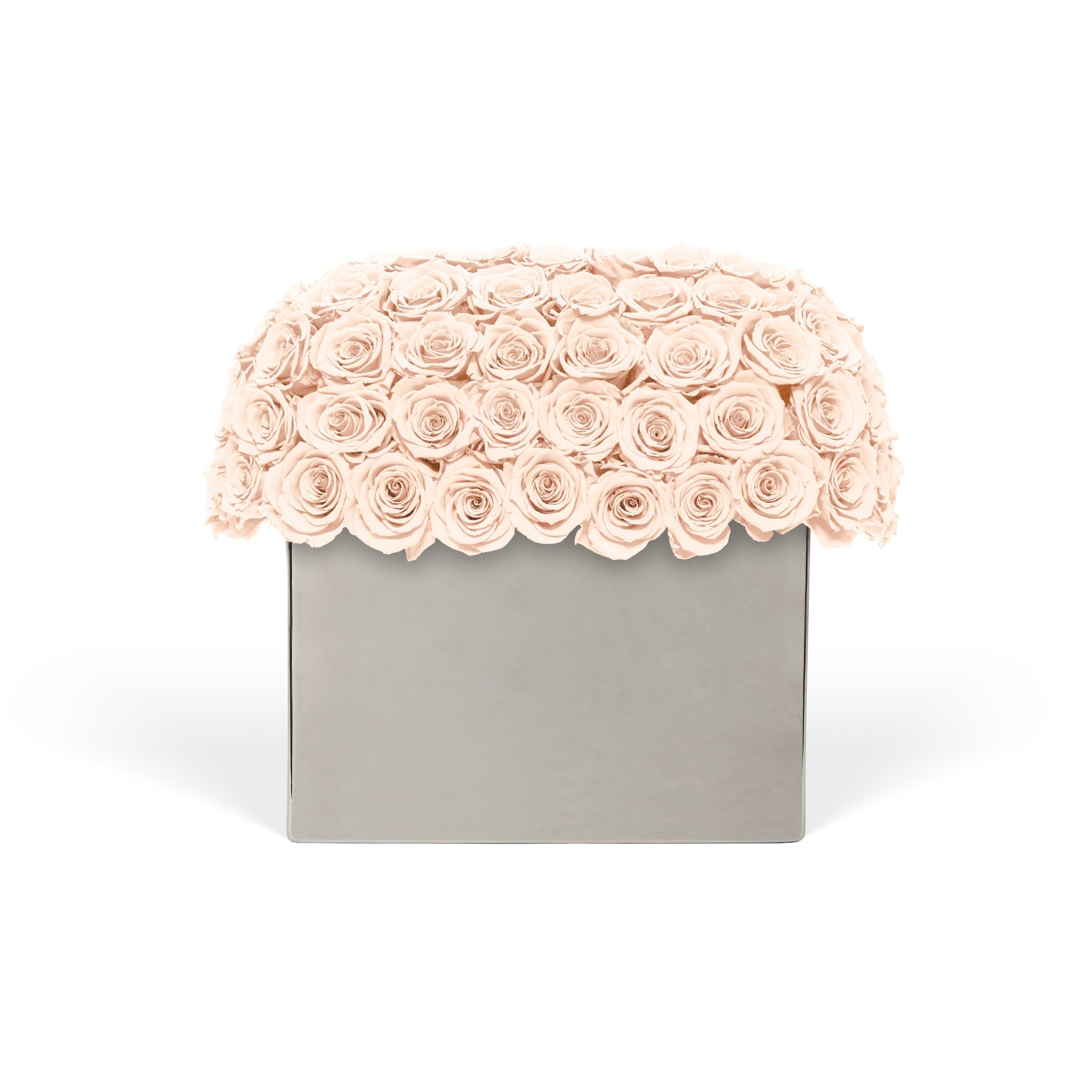 Floral arrangement with pink roses on a gray box against a white background