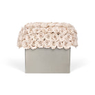 Floral arrangement in a box on a white background