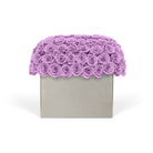 Decorative box with a scalloped edge made of purple roses on a white background
