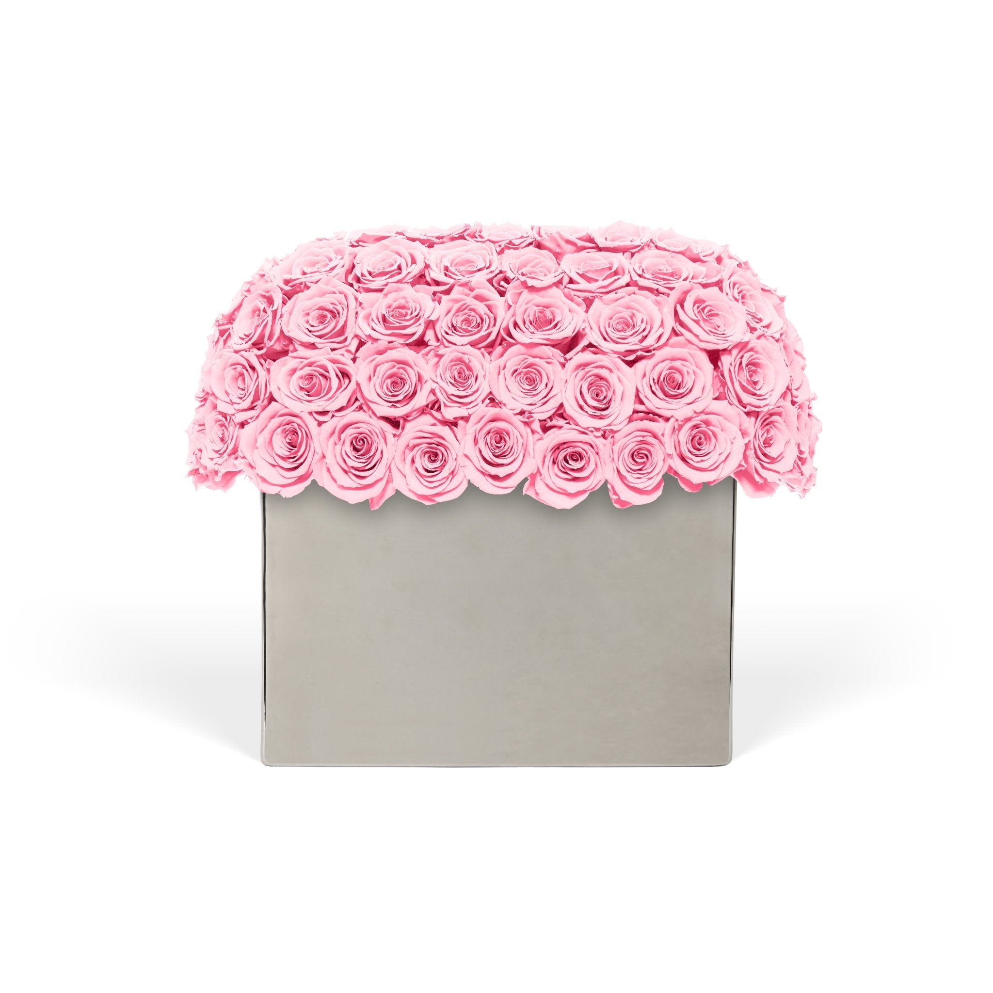 Pink rose arrangement in a gray box on a white background