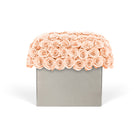 Decorative box with peach-colored roses on a white background