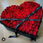 Heart-shaped box of red roses with 'OnlyRoses' branding on a beige background L Size