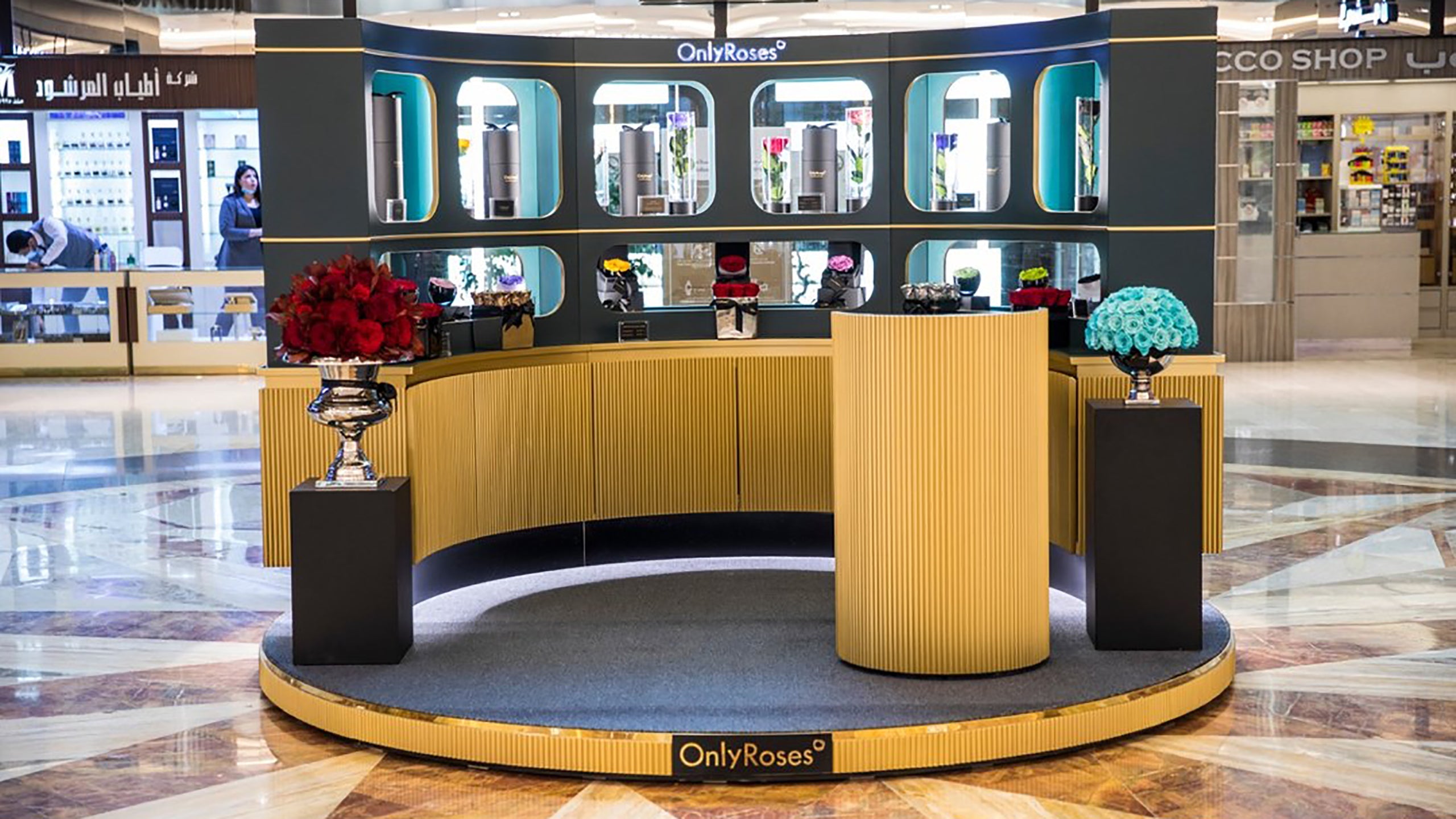 Display area with 'Only Roses' branding in a mall setting